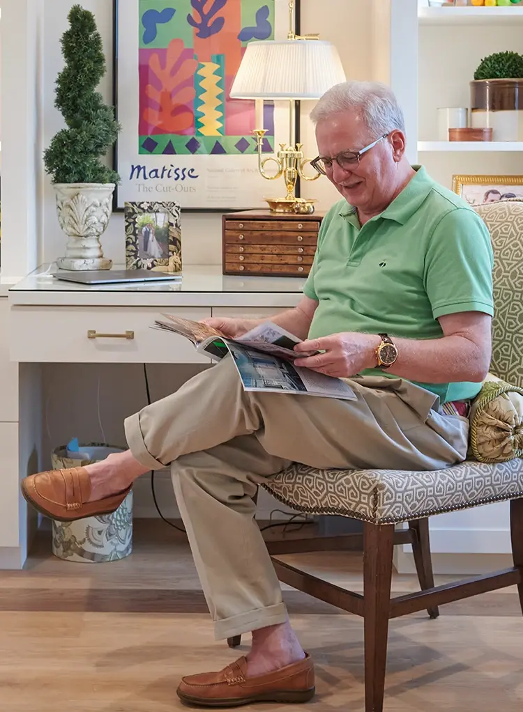 Man sitting and reading a magazine