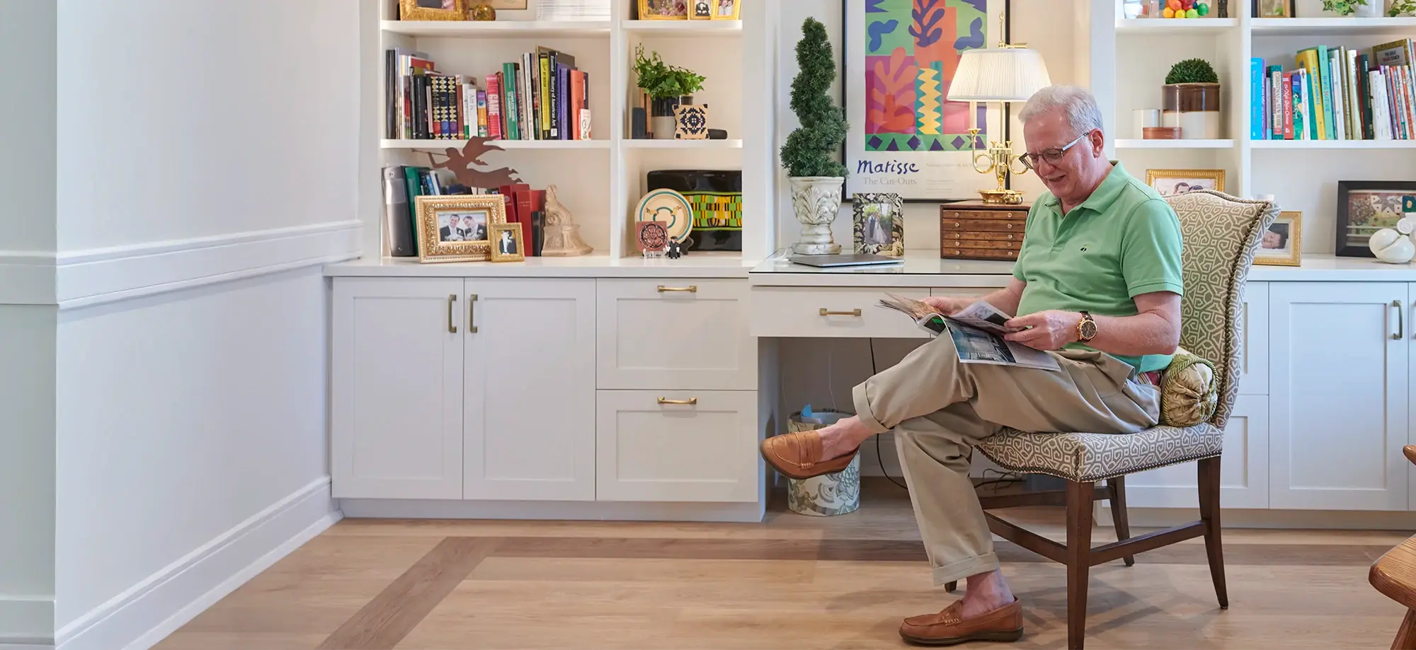 Man sitting and reading a magazine