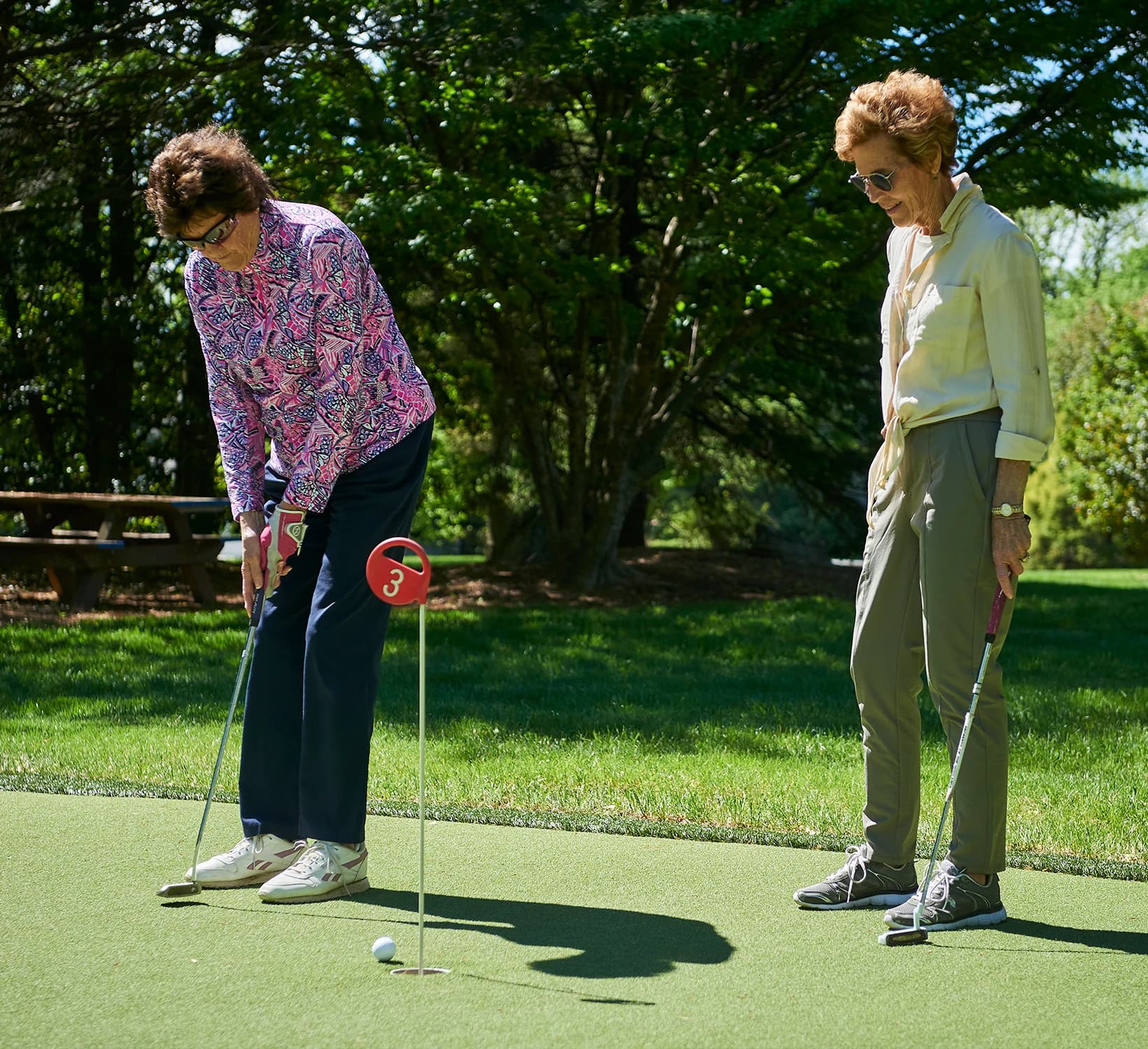 Women enjoying the putting green