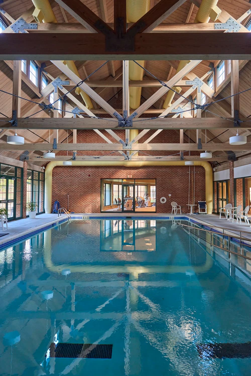 Community pool with exposed ceiling rafters