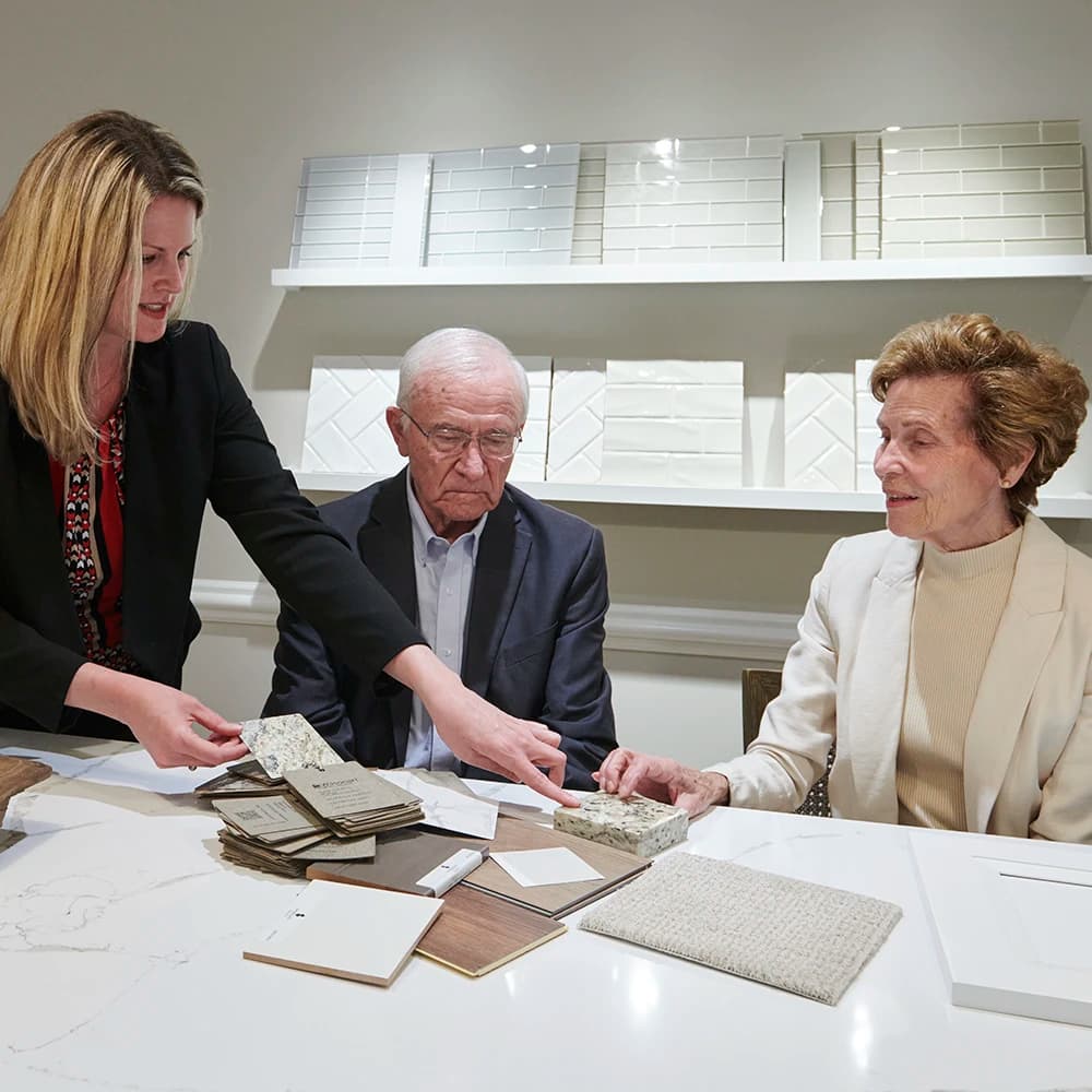 Man and woman viewing options for customization to living space