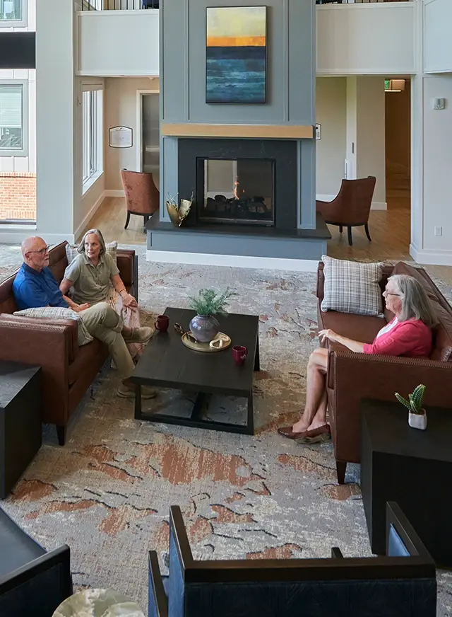 Residents enjoying conversation in large social area