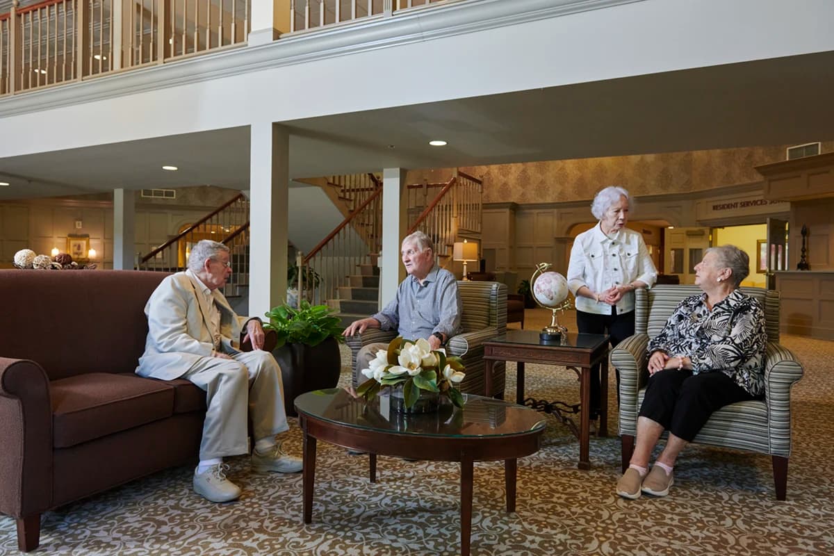 Well dressed residents in a common social area engaged in conversation