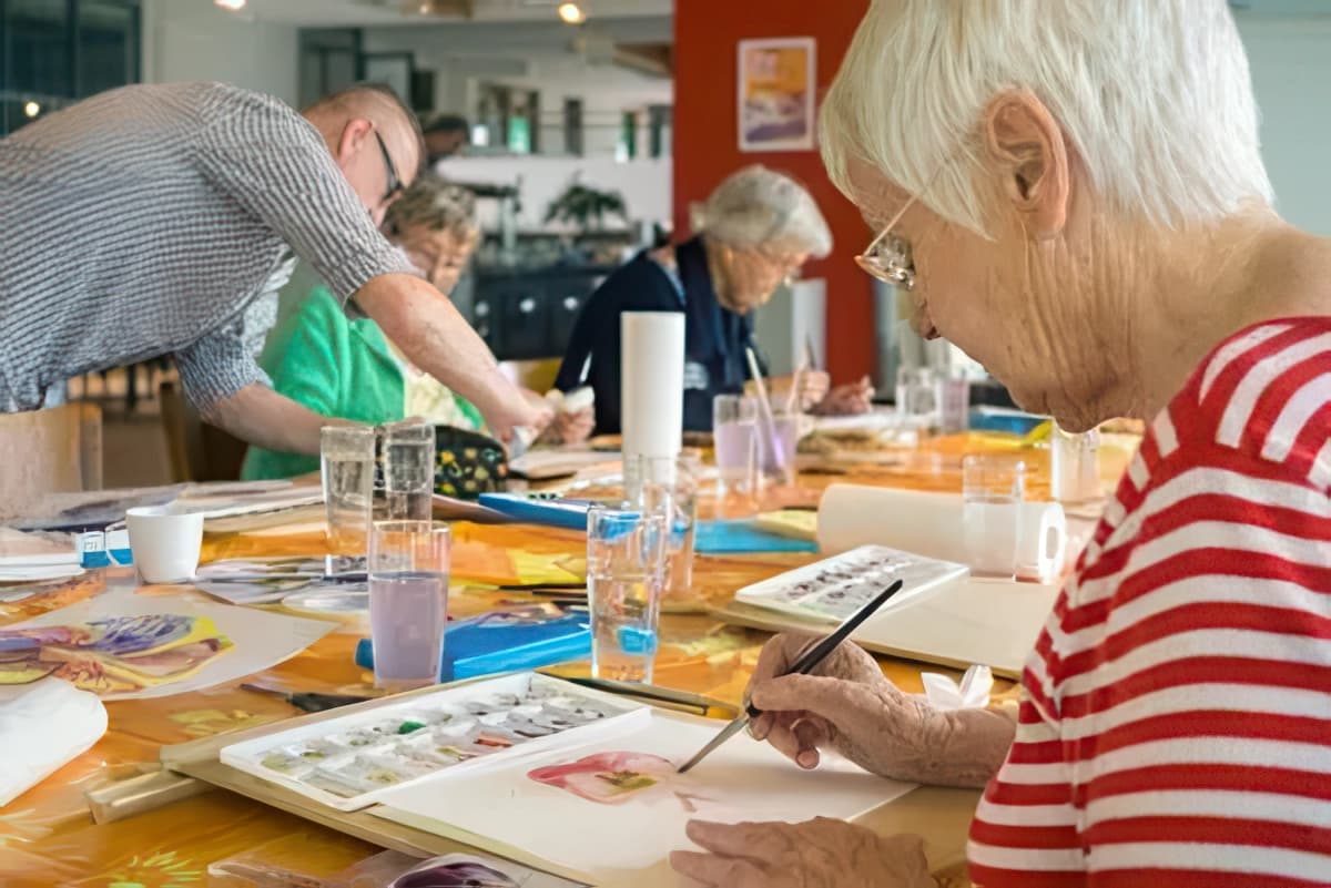 Woman painting with water colors