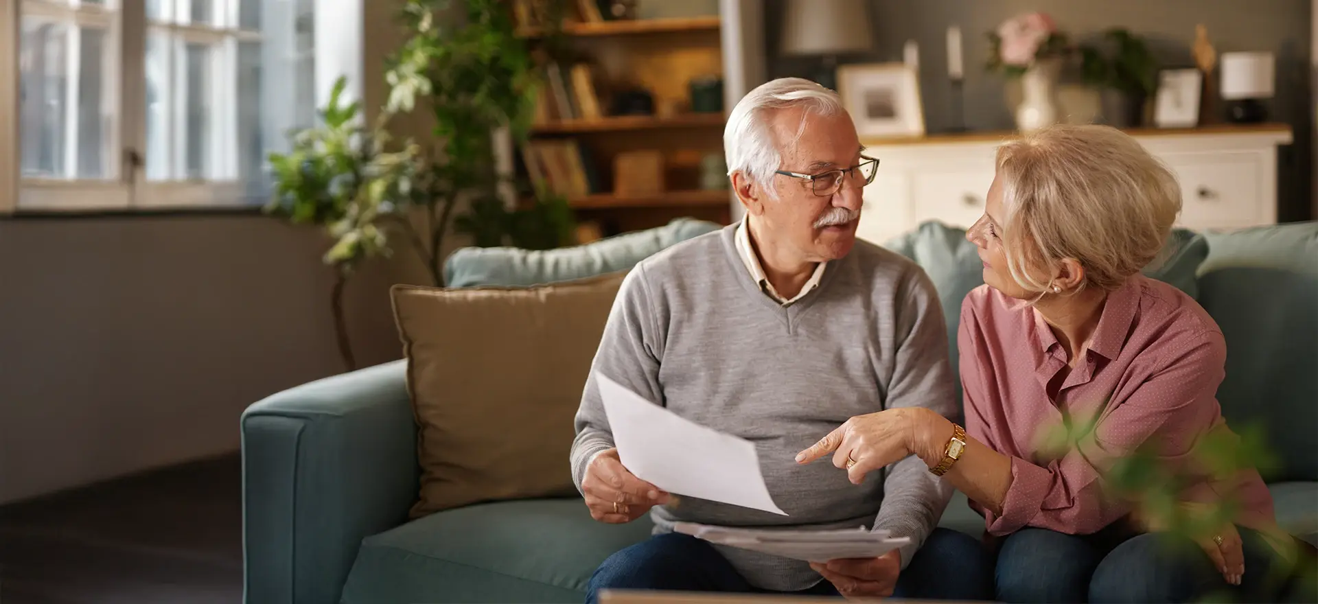 Man and woman discussing paper work