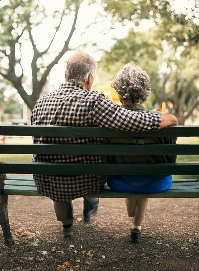 Man and woman sitting on a bench
