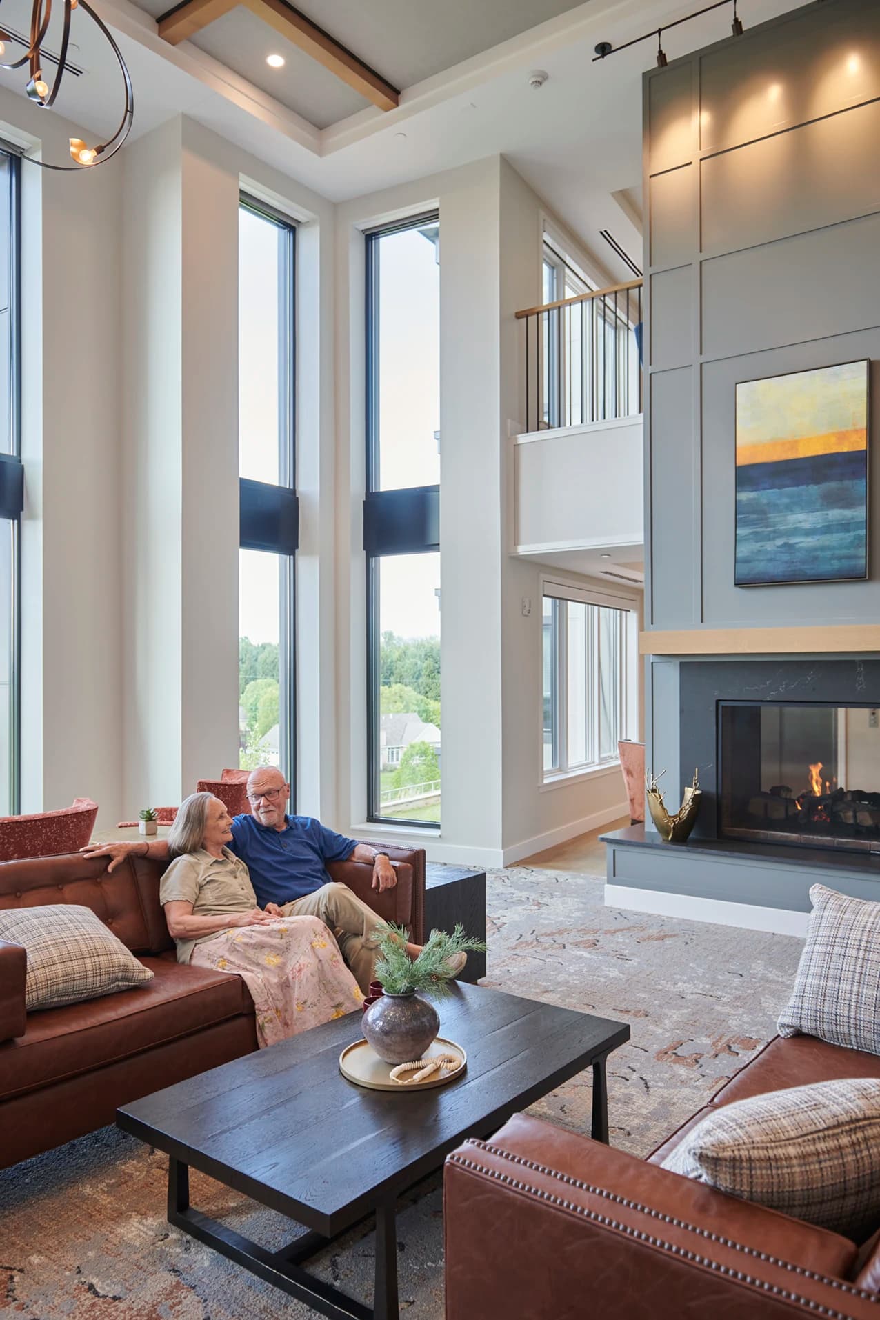 Man and woman sitting in large modern open area