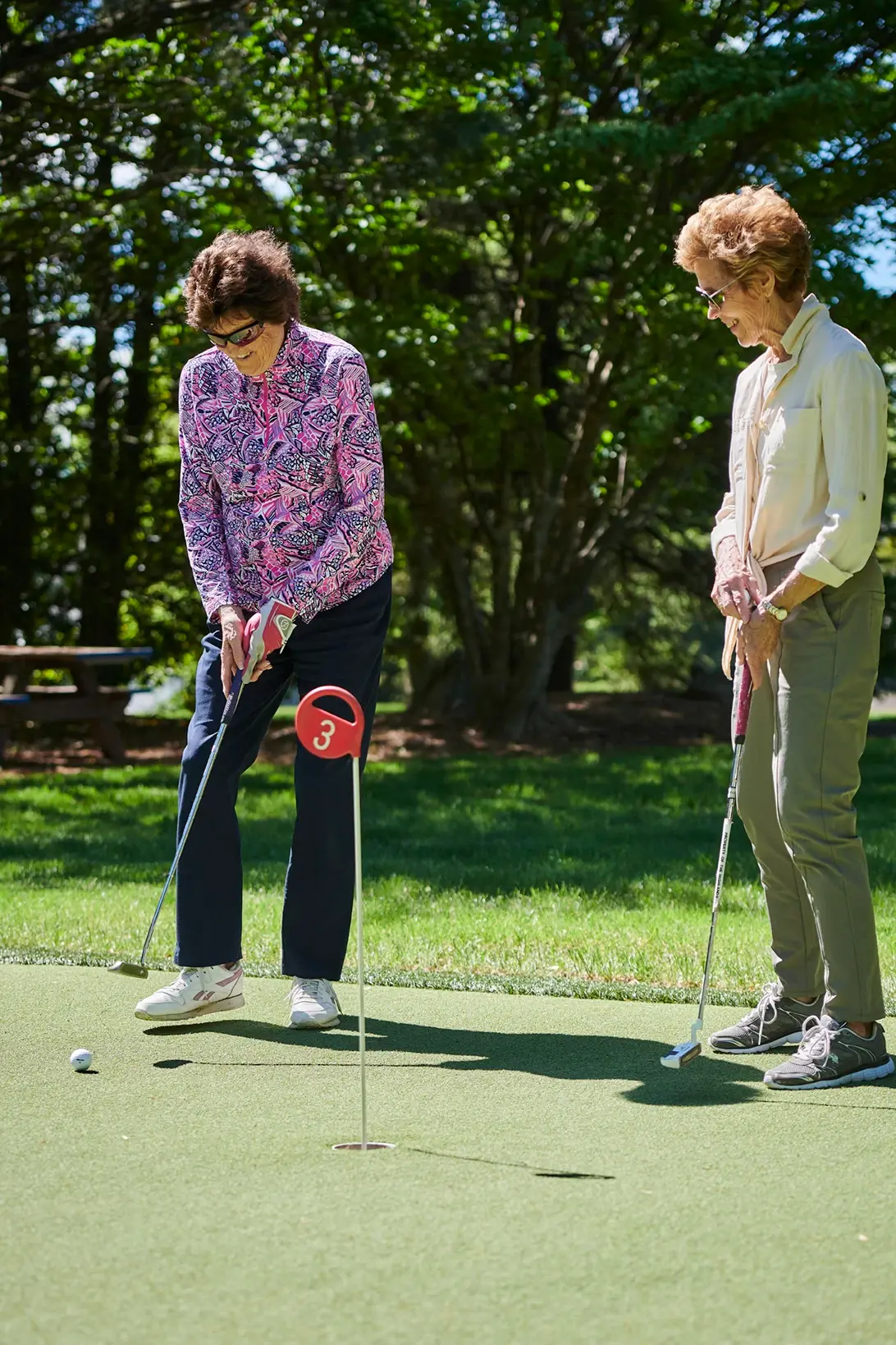 Women enjoying the putting green